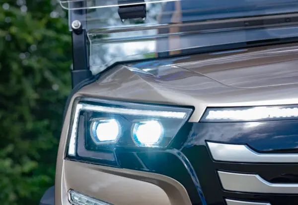 Close-up of EPIC e40FX LED headlights and front grille with bold, luxury profile
